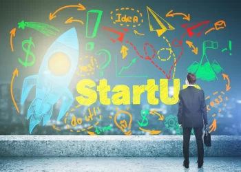 Entrepreneur envisioning startup success with creative doodles of rocket and business symbols